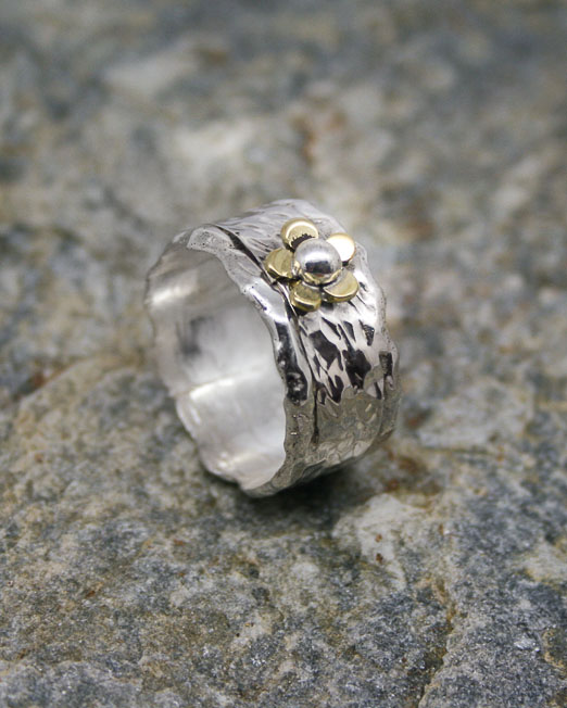 Wide sterling silver ring with flower and silver detail | Starboard ...